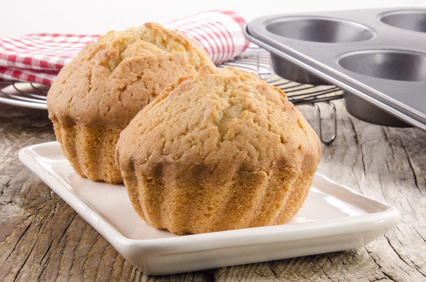 freshly baked muffins on cream colored plate